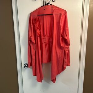 Coral open knit cardigan with rosette.